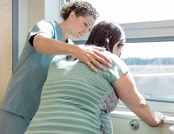 physician examining pregnant woman