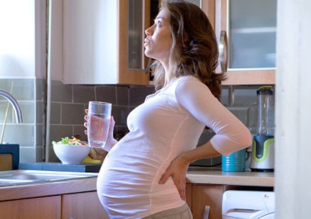 pregnant woman with glass of water